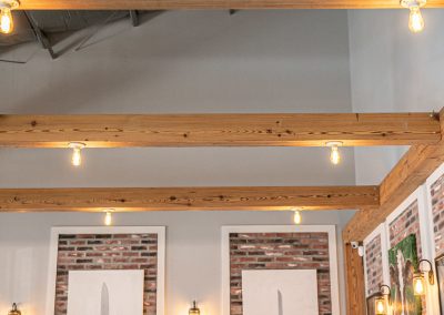 BRQ Restaurant - overhead lighting, beams, wall treatments and sconces
